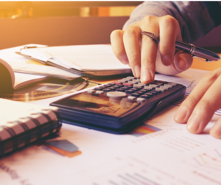 woman-using-calculator-with-doing-finance-at-home-office-picture-id644365816