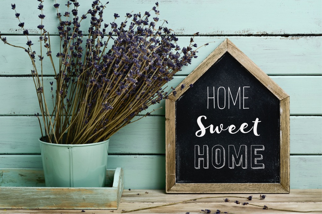 text-home-sweet-home-in-a-houseshaped-signboard-picture-id594450002